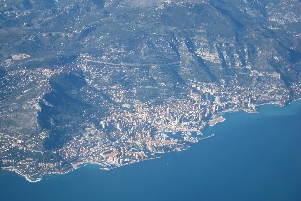 Aerial view of the Principality of Monaco between sea and mountain